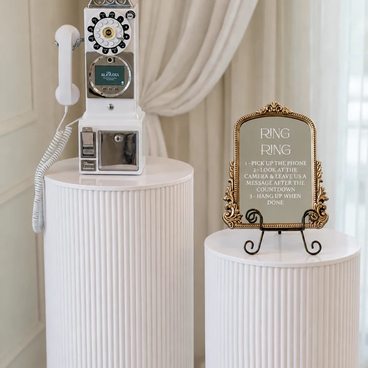 Video Guest Book with two white pedestals and included gold instruction mirror for a Miami wedding rental.